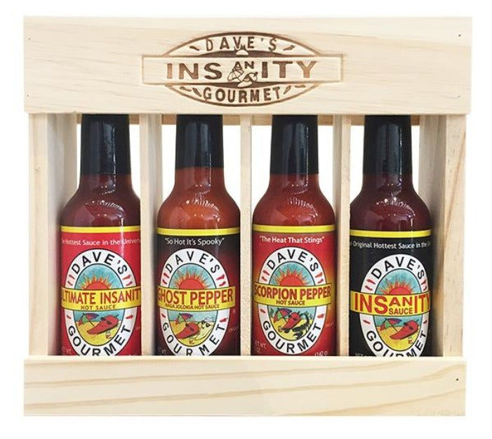 Wooden gift box set with four different hot sauce varieties