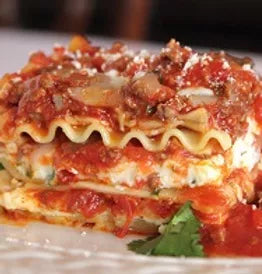 An image of lasagna with marinara sauce